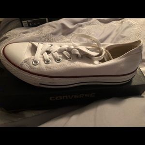 Low top white converse sneakers.